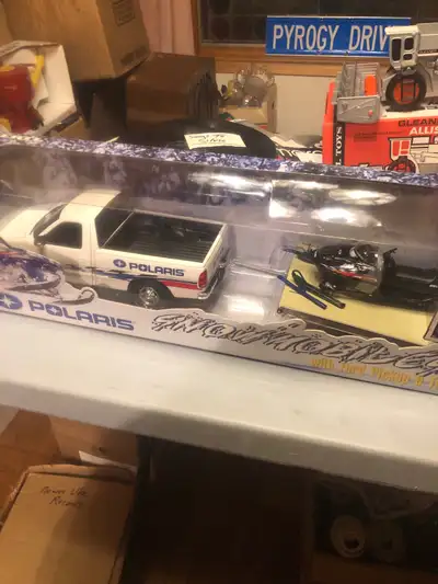 Dealer item only from 2000–ERTL Truck/ trailer/ sled combo/- XC-500. Never opened NIB. 175.00. obo....