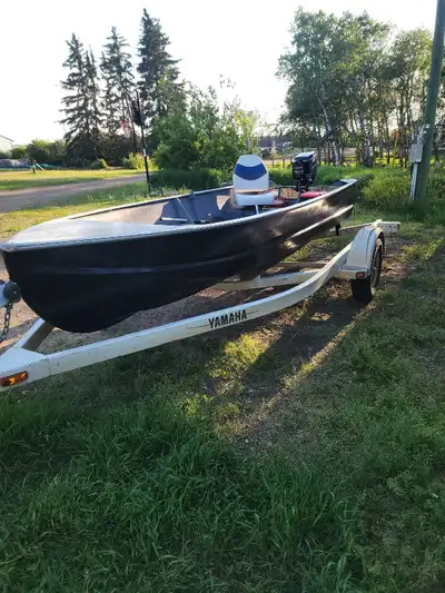 14ft aluminum fishing boat. Repainted and has 2 swivel chairs, small trolling motor. Mercury 9.9hp e...