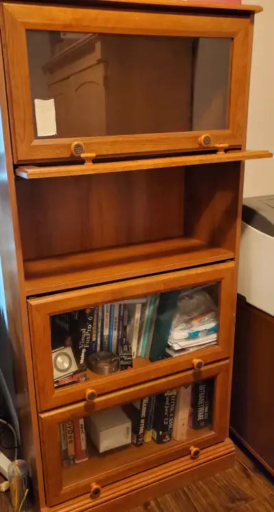 Purchased from Tepperman Glass door bookcase /storage cabinet Walnut wood color, glass door, pull up...