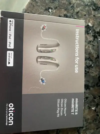 Brand new hearing aids from Oticon. This is the miniRITE R model in a silver finish. Set includes tw...