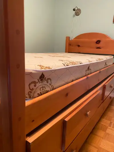 Twin bed made of pine 84 inches x 43 inches x 44 inches tall Two storage drawers 36 inches x 24 inch...