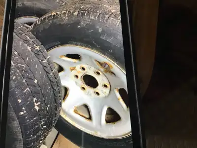 GMC rims with winter tires no cracks no plug ,tires 25% good for farm use,