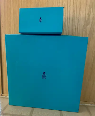 Birks blue cardboard boxes from the 70’s. Larger antique box is 15.25 X 15.25 X 3 inches. It has som...