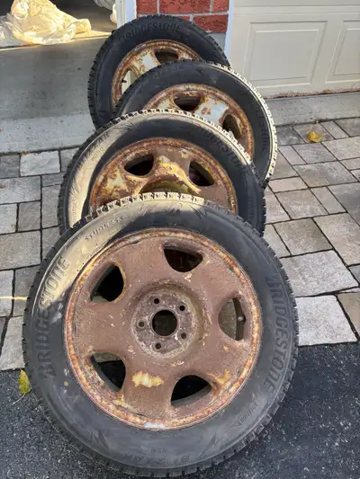 Winter tires Blizzak WS90 on rims. Tires have a couple of seasons left in them. The rims have some c...