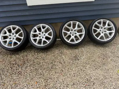 4x Mazda rims with one which is bent and tires- Yokohama Avid envigor 225/40R18 92W Came off a Mazda...