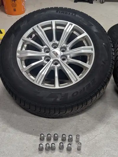 Set of four 6 bolt rims mounted with Pirelli Ice Zero 235/55/R18 with nuts, locking nuts and plus TP...