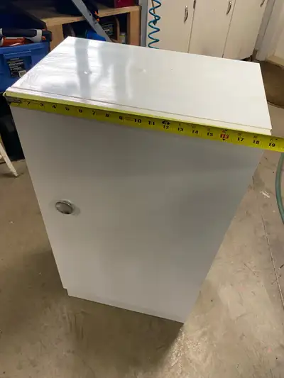 White metal cabinet. Dimensions 36 “ tall 12 “depth 19 “ width. Please see photos