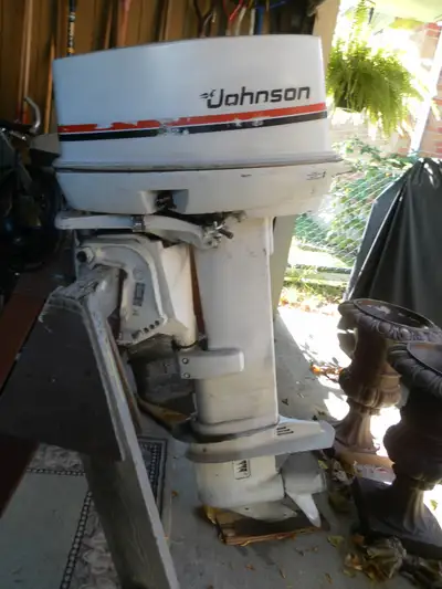 35 JOHNSON OUTBOARD LONG SHAFT WITH CONTROLS, ELECTRIC START, LOW HOURS, NEW PLUGS AND BOTTOM OIL.