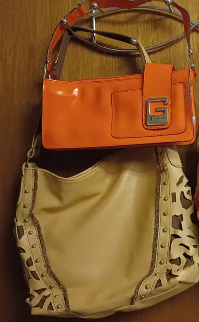 1  NEW GUESS HANDBAG AND ONE NEW AVON HANDBAG, View more