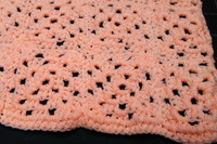 New coral colored 34 x 34-in hand-crocheted afghan baby blanket