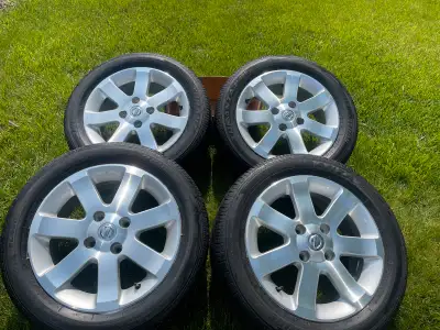 Like new barley used Nissan Sentra 16 inch alloy rims with tires