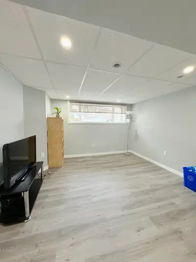 One private room in a two bedroom basement suite with big legal windows with shared kitchen, washroo...
