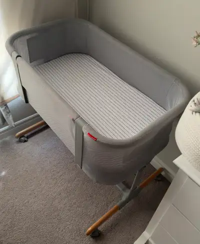 Very clean bedside bassinet in excellent condition. Height is adjustable and it has wheels. From a s...