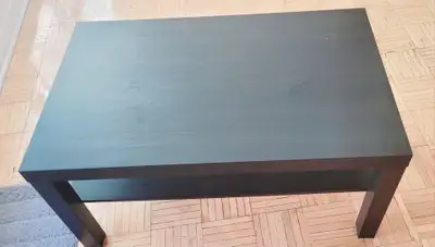 This IKEA LACK coffee table in a sleek black-brown finish is a versatile and minimalist addition to...