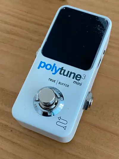 It's new. It tunes. Used twice - ended up getting a volume pedal with tuner built in to it and this...