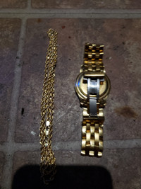 14 k rope chain and gucci watch.  Want to trade for bigger chain