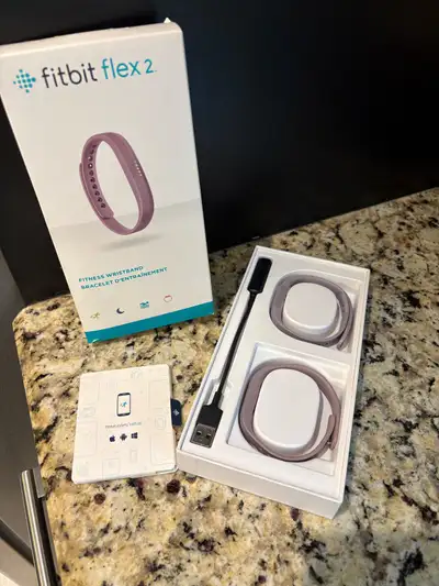 Fitbit Flex 2 fitness wristband. Contains 2 bracelets ( small and large) and a removable tracker and...