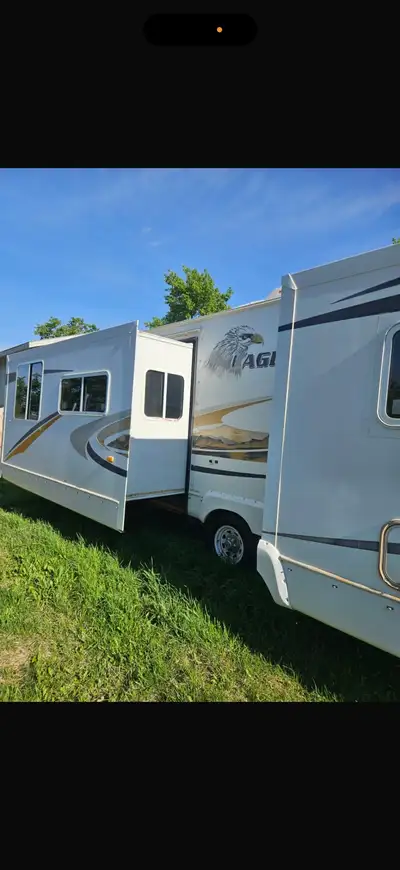 Eagle Jayco 2007 spacious 30 foot trailer with slide out section. Ladder on back and spare tire moun...