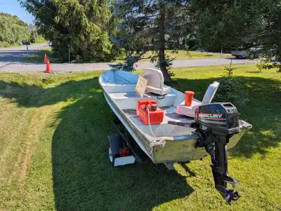 14 foot Aluminum Boat 15 hp Merc two stroke runs nice , new seats and brackets . Trailer has new whe...
