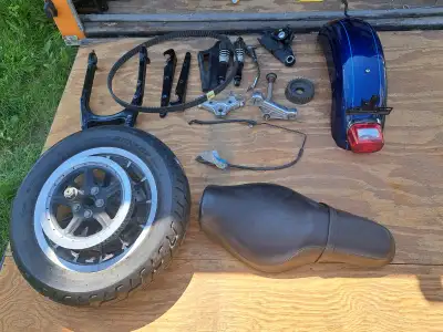 Complete rear end from an XL1200 low. Original bike was converted to a trike. Parts include rear whe...