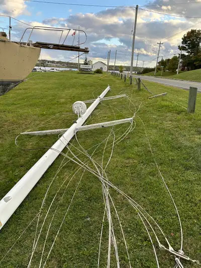 Complete sailboat mast and boom available, measuring 50 feet 8 inches. This mast was deck-stepped on...