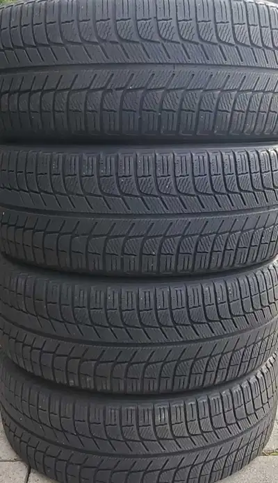 Four used Michelin X Ice Winter tires, the size is 215/55/17. Good tread remaining, must be seen to...