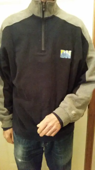 This is a men's size medium Denver Nuggets NBA quarter zip fleece pull-over made by Cutter and Buck...