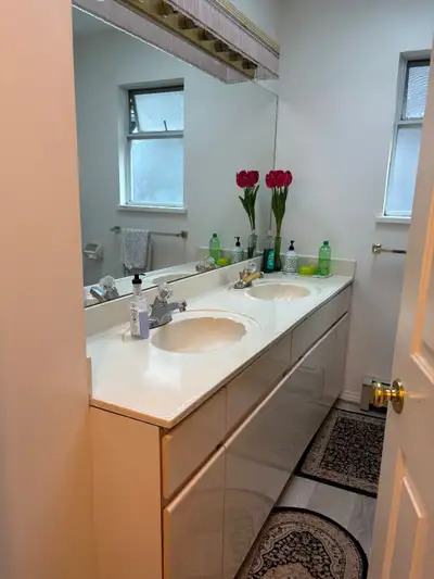 1 Furnished bedroom with closet & shared bathroom and dedicated sink area in shared bathroom with on...