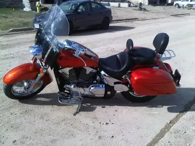 Beautiful custom candy orange with subtle candy red flames paint Custom hard saddel bags/mustang sea...