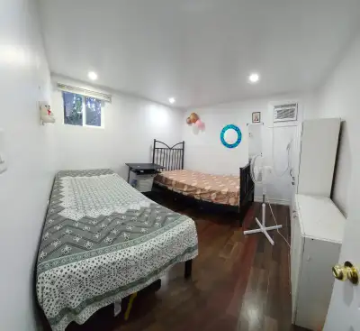 Sharing Room on MAIN FLOOR AVAILABLE for girls/boys/couples from may 01 LEGAL Upper Level basement A...