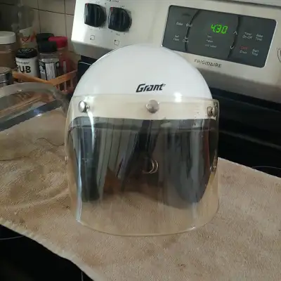 1970's Grant helmet . Comes with 2 face shields . Size L to XL . Great shape for 50 years old .Look...