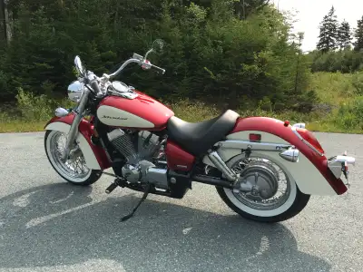 Honda shadow, two tone color metallic red and cream, white walls, chrome rad cover, leather saddle b...