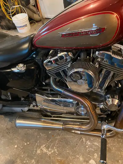 2009 HD sportster 1200 XLC. Quick release windshield, saddlebags, mustang solo seat, rear fender rac...