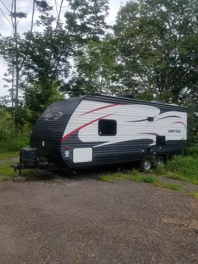 Aspen Trail Camper for sale. Trailer is 21 feet long not including the hitch. It has a queen bed and...