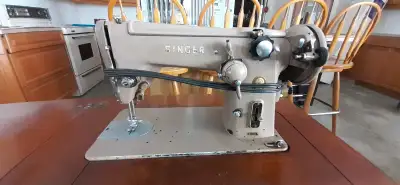 If ad is up, item is available. Vintage Singer Sewing Machine in Cabinet. Model 306K. Has foot pedal...