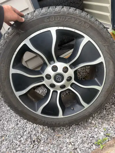 Selling my 22 inch Harley Davidson rims with good year work horse tires 185/45/22 tires are two year...