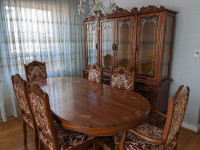 Dining room table with 6 chairs and hutch.