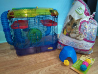 Used Critter Trail Hamster Home with open bag of bedding