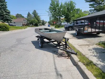12 ft boat 8 HP johnson with tank and hose Trailer with new tires/rims with new Spare , new hubs and...