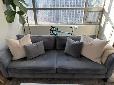 92 inch wide blueish grey elte market couch in excellent condition. Pick up Monday April 20th at 4pm...