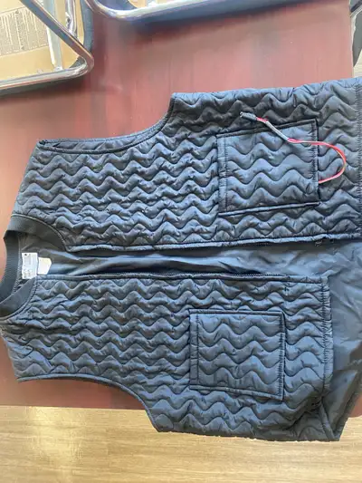 1 heated motorcycle vest. Has plug for accessory hook up to motorcycle. Like new. $50.00 OBO.