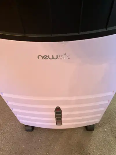 Newair evaporative air cooler- it works by passing outdoor air over water-saturated pads, the water...