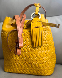 Lodi’s Leather Rodeo Woven Crossover handbag