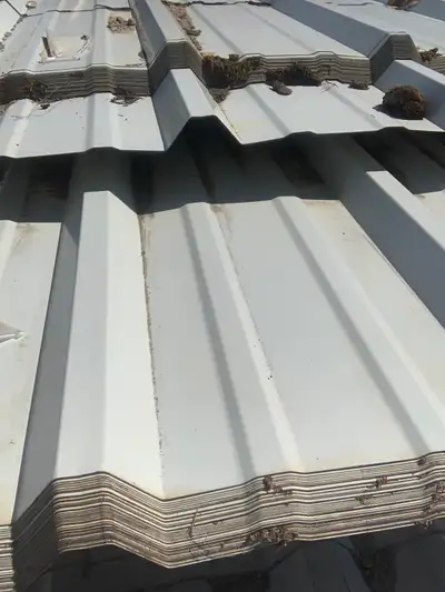 Old new stock 18 feet long 39” wide White steel siding 100 sheets available. $30/sheet