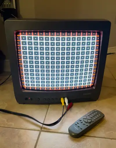 This vintage Toshiba 13A21C 13 Inch CRT TV is a retro gaming television with a sleek black design an...