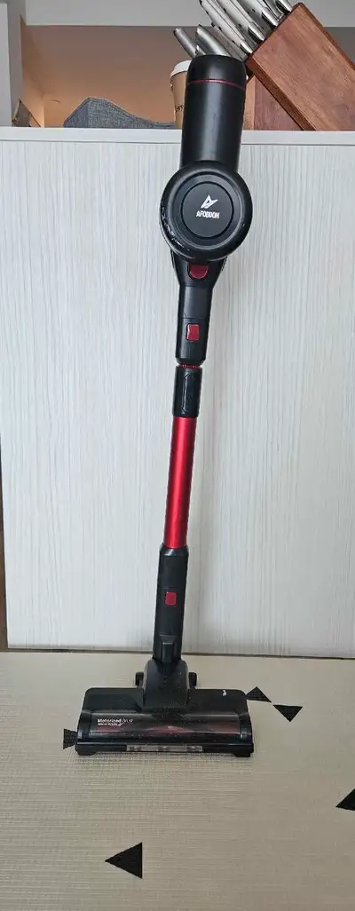 Affodon Vacuum. Works well, but cosmetic damage. Very light. Can clean 600 sqft apartment in one cha...