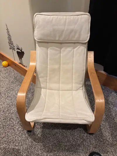 This is an IKEA Poang chair that's perfect for adding a touch of comfort to any room. It's in used c...