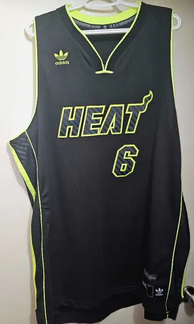 Own a piece of basketball history with this limited edition XXL LeBron James Miami Heat jersey, feat...