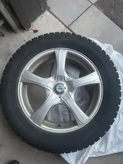 18 inches alloy rims - Bridgestone Blizzak tires included. One of the rims is missing its plastic co...