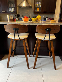Two midcentury modern counter stools - wood / faux leather